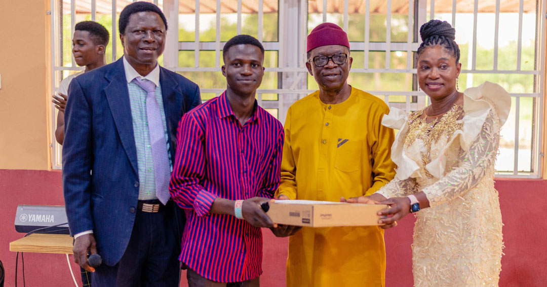 Tau Celebrates Anniversary In Grand Style, As Founder Presents New Laptop To Scholar